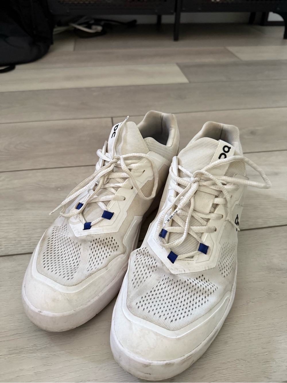 On Running Men’s Off-White Sneakers with Blue Accents